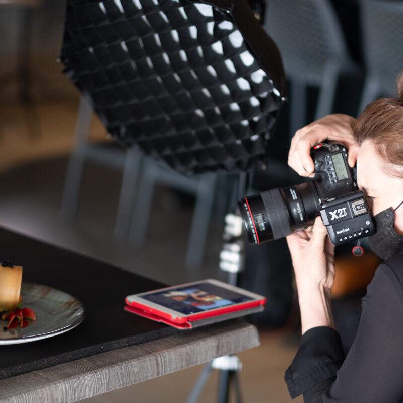 Winifred Harms, a professional food photographer, passionately capturing the essence of culinary delights through her lens.